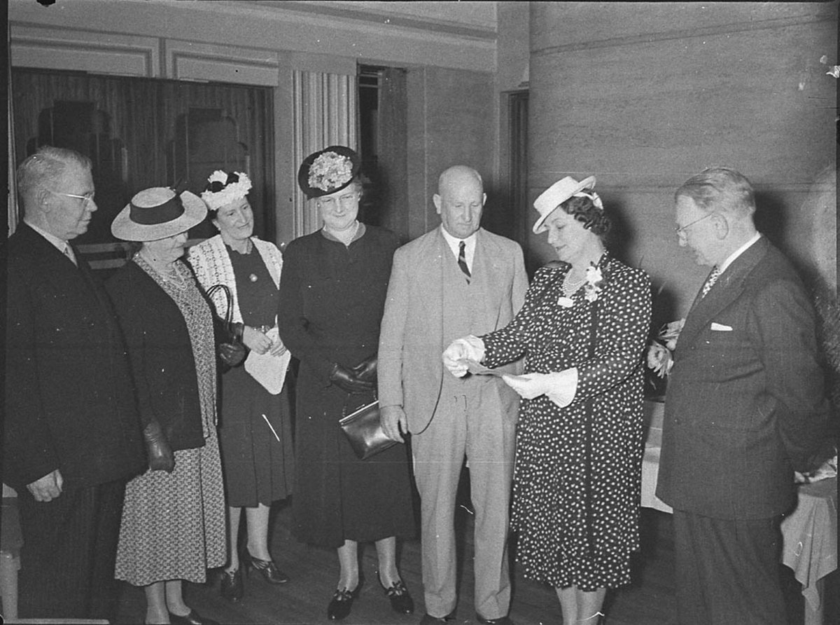 Presentation of cheque to Mr Clarence Moss by Mrs Grace (1940)