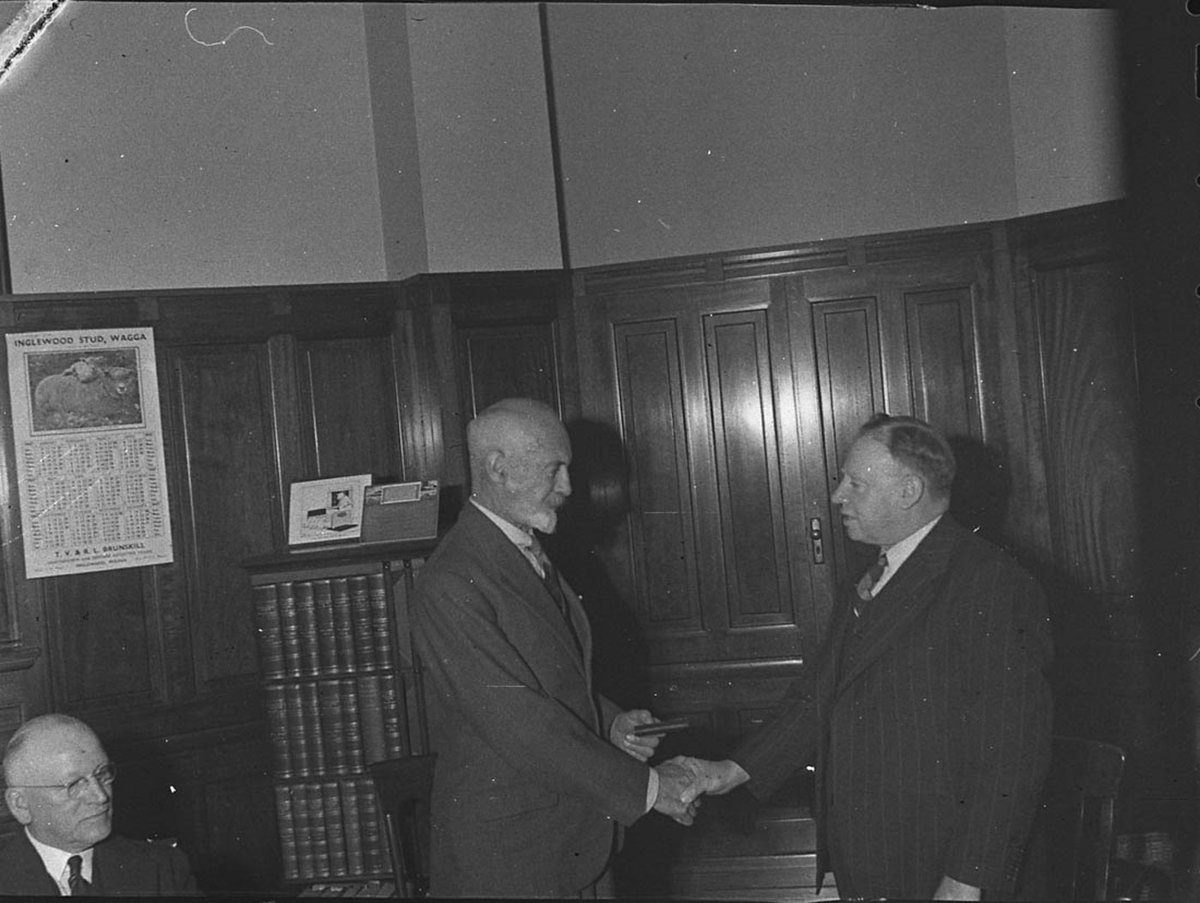 Prsentation to Mr McHeary by Minister for Agriculture taken for Smiths Weekly (1947)