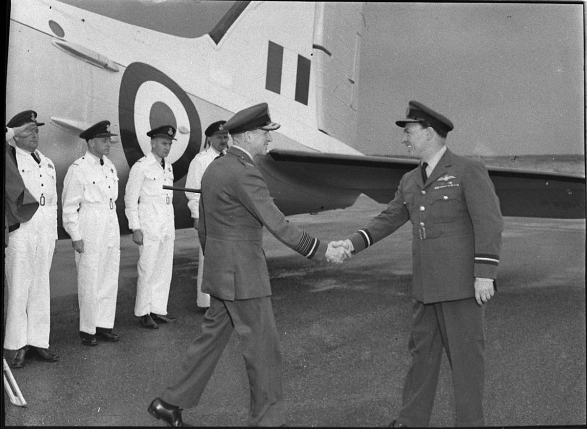 RAF Air Chief Marshal Sir John Baker left greeted on arrival by the OC of Williamtown RAAF Base Air Commodore AG Adams (1957)