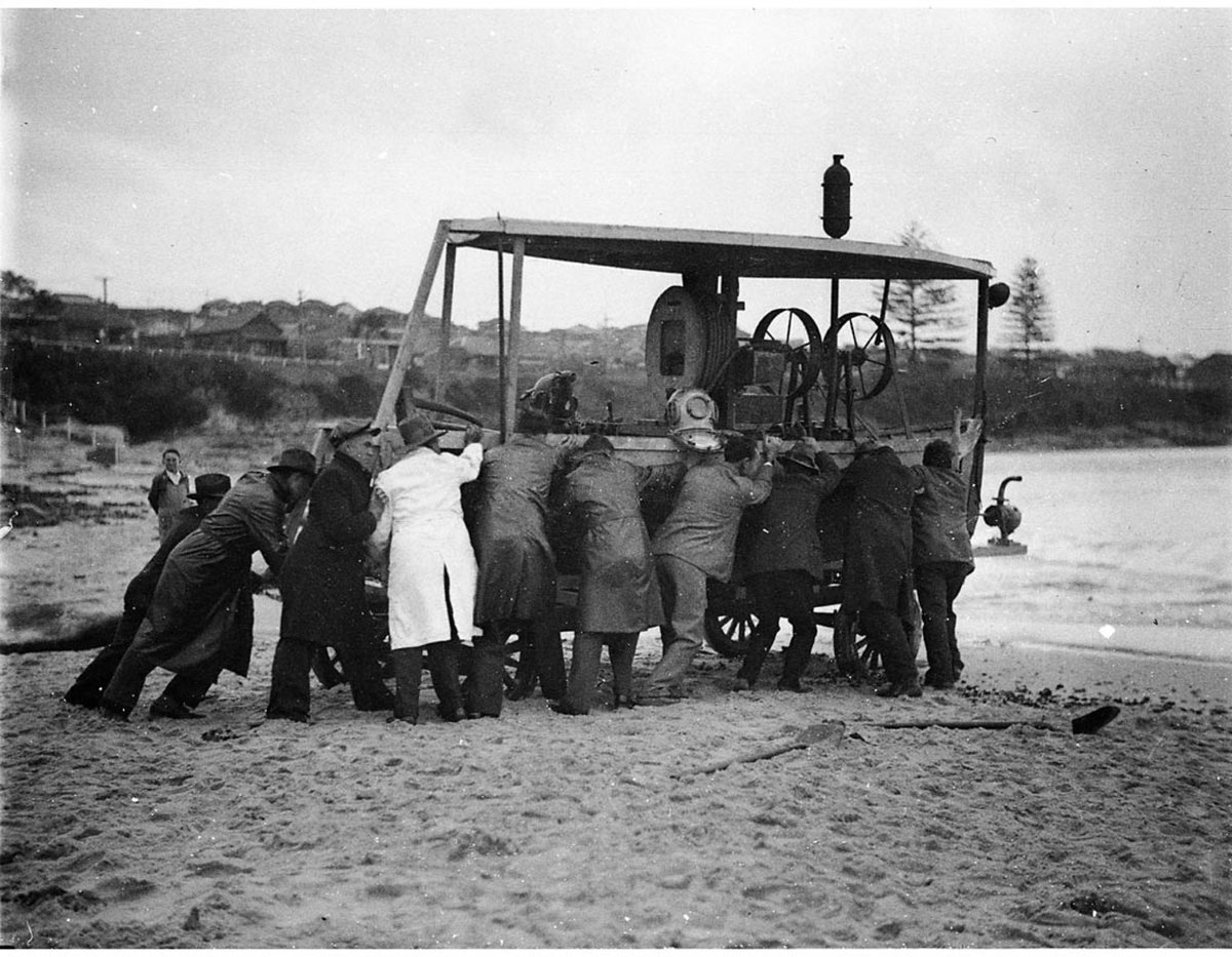 Raising a sunken power barge from harbour bed ie Divers and their helpers with their diving rig Malabar wreck Maroubra (1933–34)