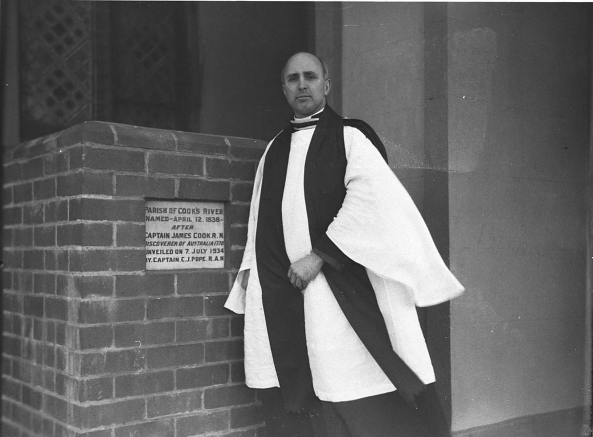 Rev Frederick Hugh Hordern beside the plaque Parish of Cooks River named April 12 1838 after Captain James Cook RN discoverer of Australia 1770 Unveiled on 7th of July 1934 by Captain CJ Pope RAN (1935–37)