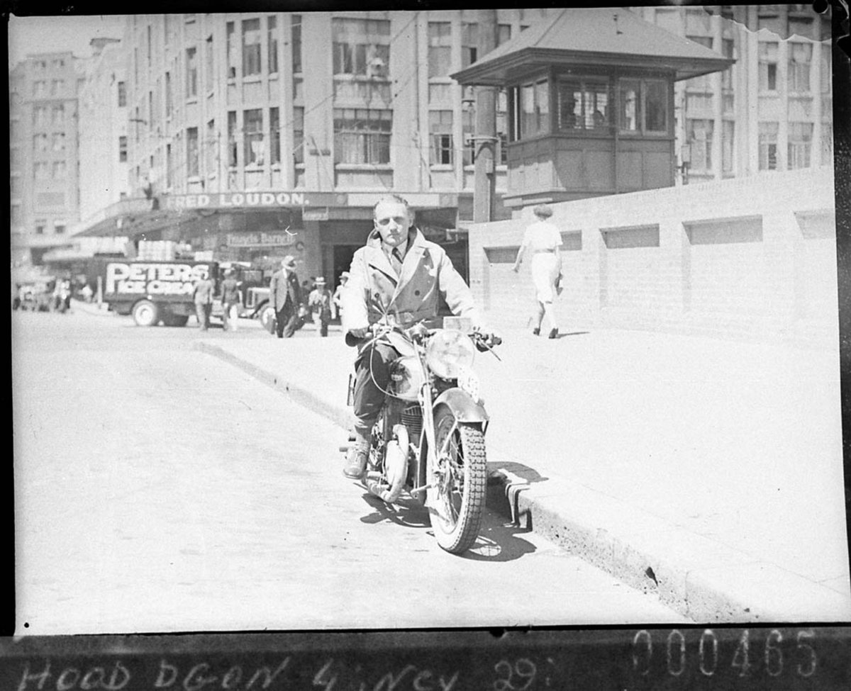 Salesman demonstrating a Francis-Barnett motorcycle, Sydney city centre (1938)