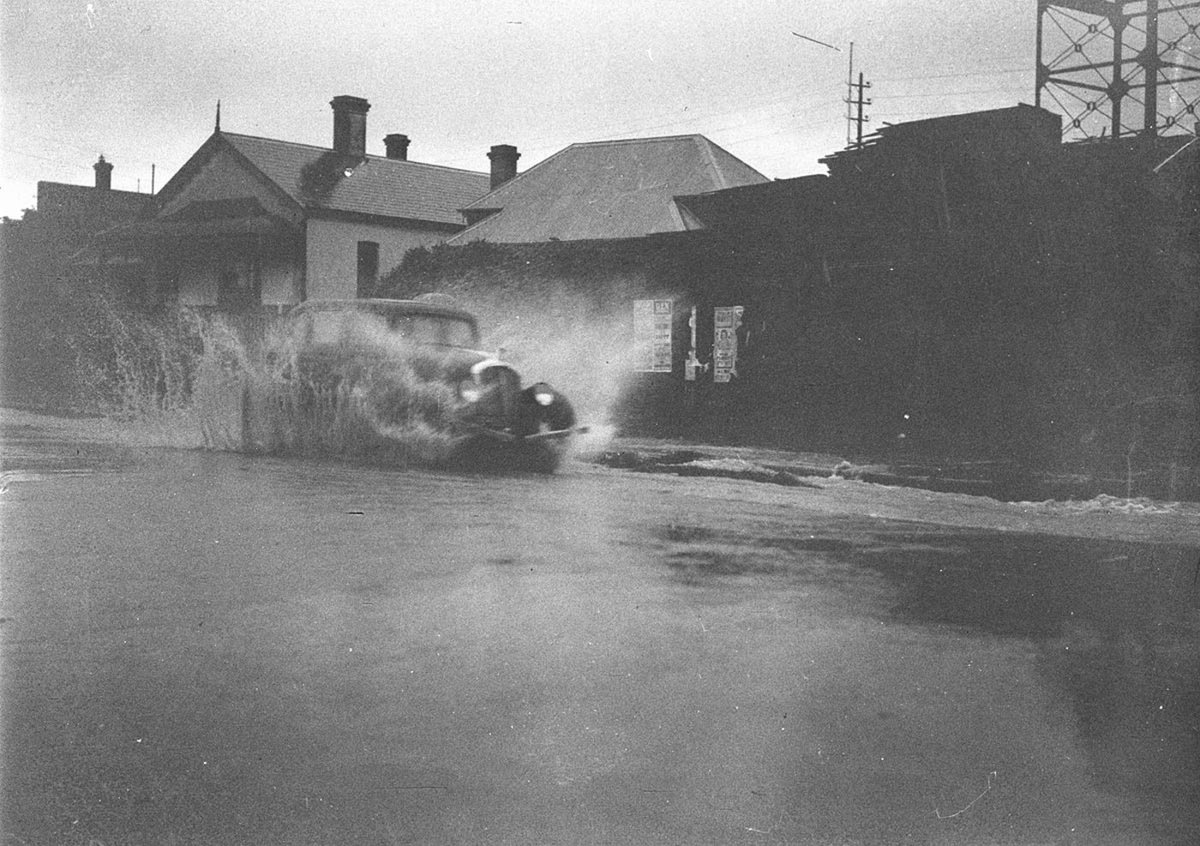 Sam Hoods 1934 Willys 77 in a flooded street