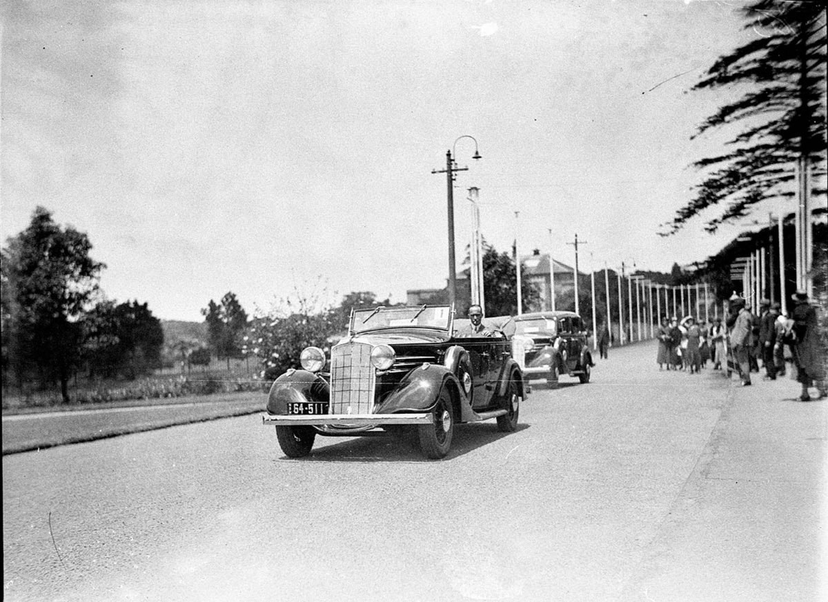 Scott and CampbellBlack winners of the MacRobertson International Air Race 1934 in Vauxhall tourer Government House, Sydney city centre