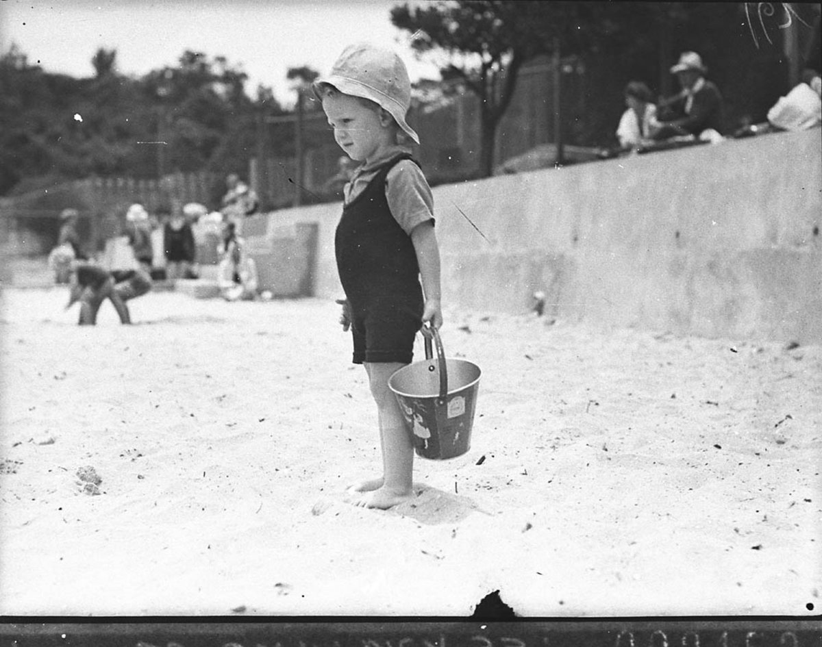 Small boy with his sandbucket (1935)