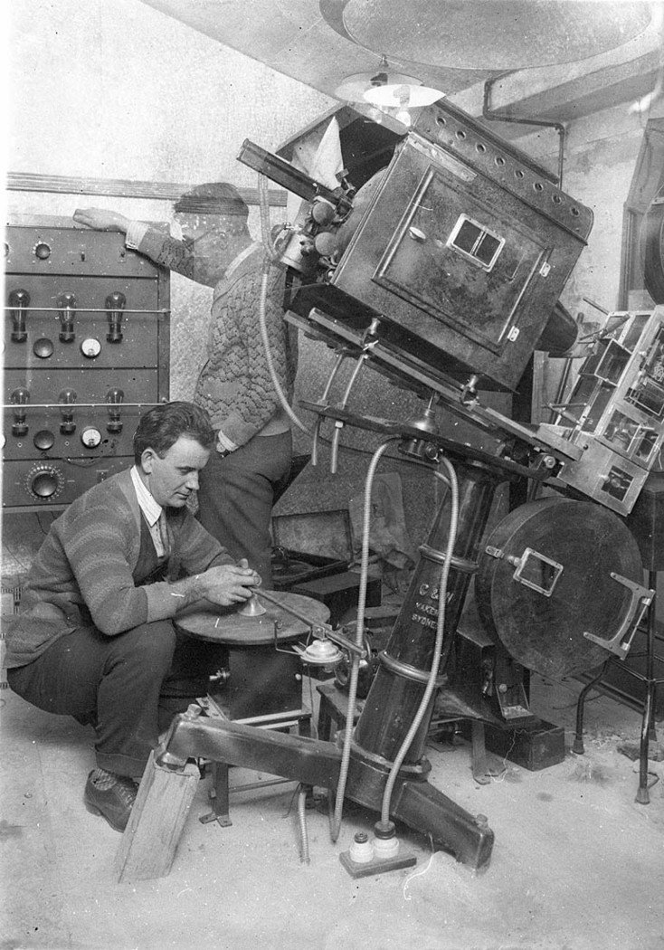 Sound technicians setting up the turntable and amplifiers for the first talkies in Australia Warner Brothers Jazz Singer starring Al Jolson at the Lyceum The sound was recorded on a synchronized disc (1927–28)