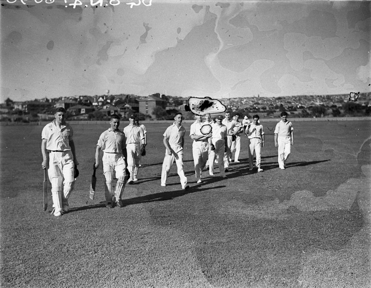 Tea adjournment batsmen and fieldsmen leave the field (1930s)