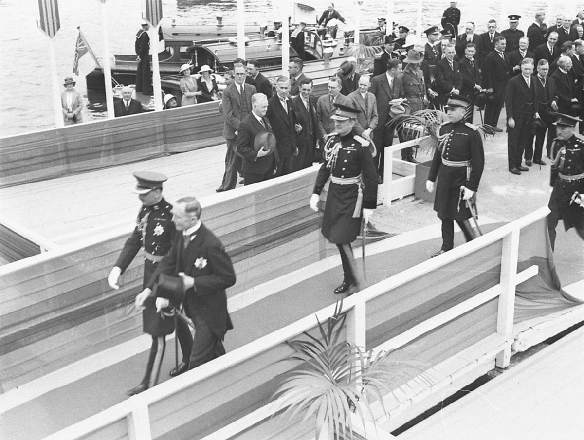 The Duke steps ashore and is escorted by Governor Sir Philip Game (1934)