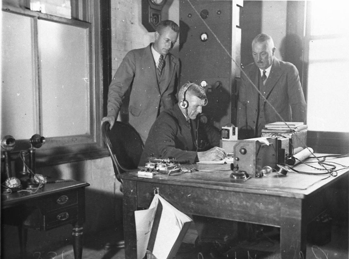 The first NSW Police wireless room Commissioner Childs in backgroud (1930s)