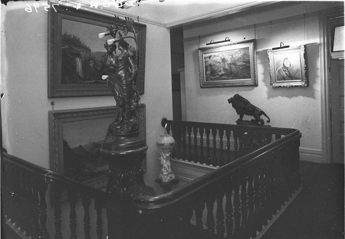 Top of the staircase Bronze statue of Lovers figurines of nymphs a rambling lion Paintings on the walls A Mountain Waterfall A Picnic and An Aviator in Danmark home of WJ Smith between 19271936 (1927–36)