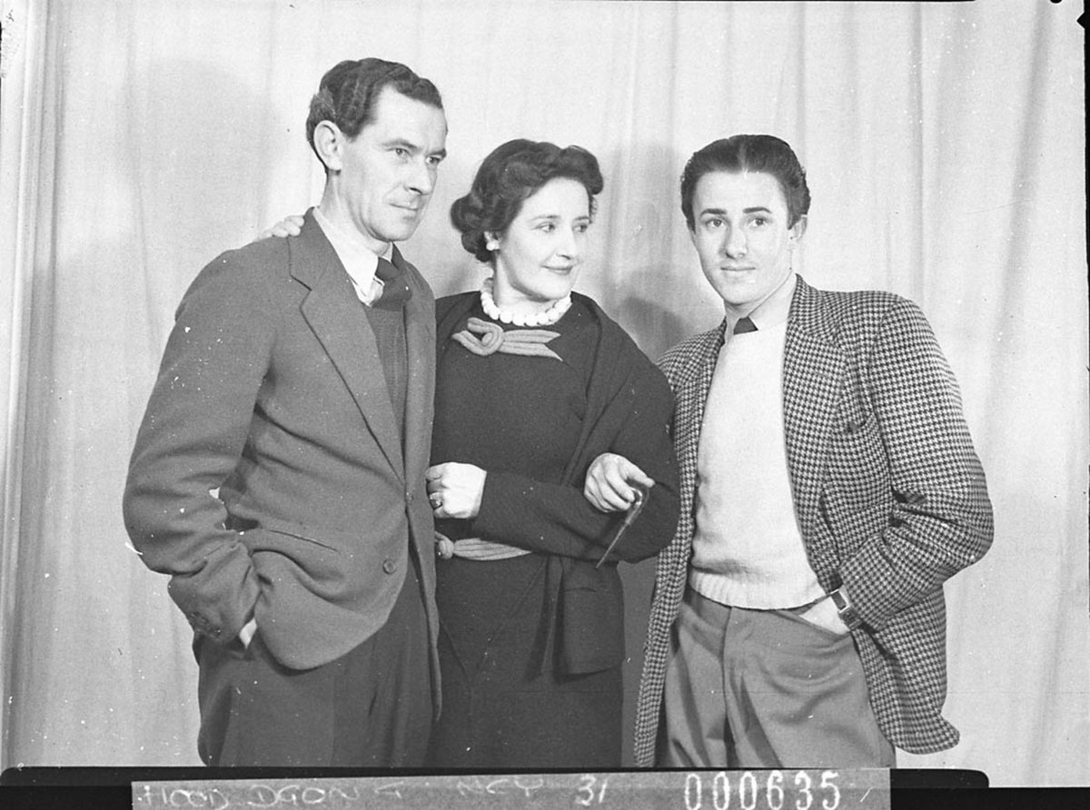 Two actors holding the arm of an actress scene from These Children BritishAustralian production (1944)