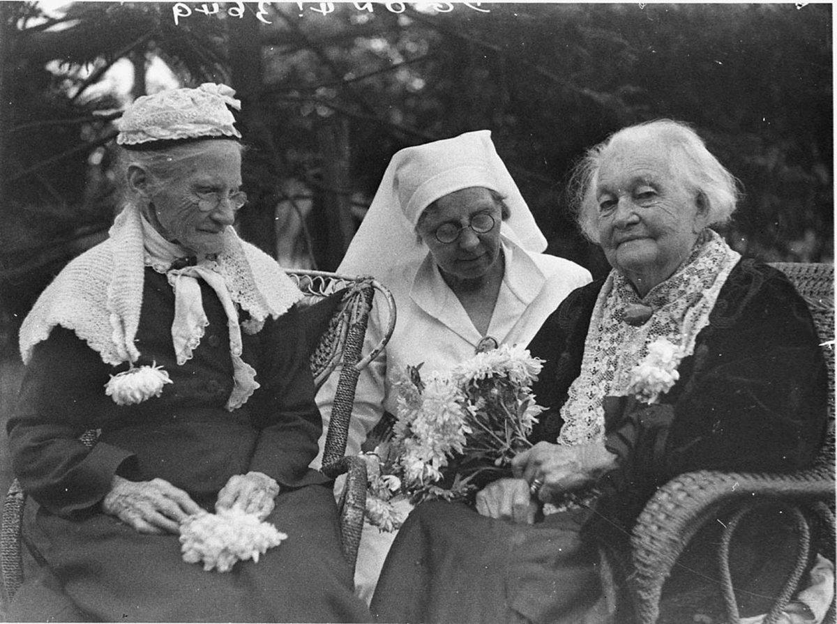 Two old women with nurse (1930s)