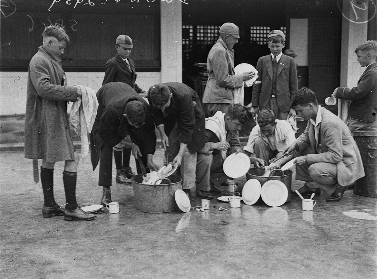 Unidentified schoolboys washingup picnic plates etc (c. 1930)
