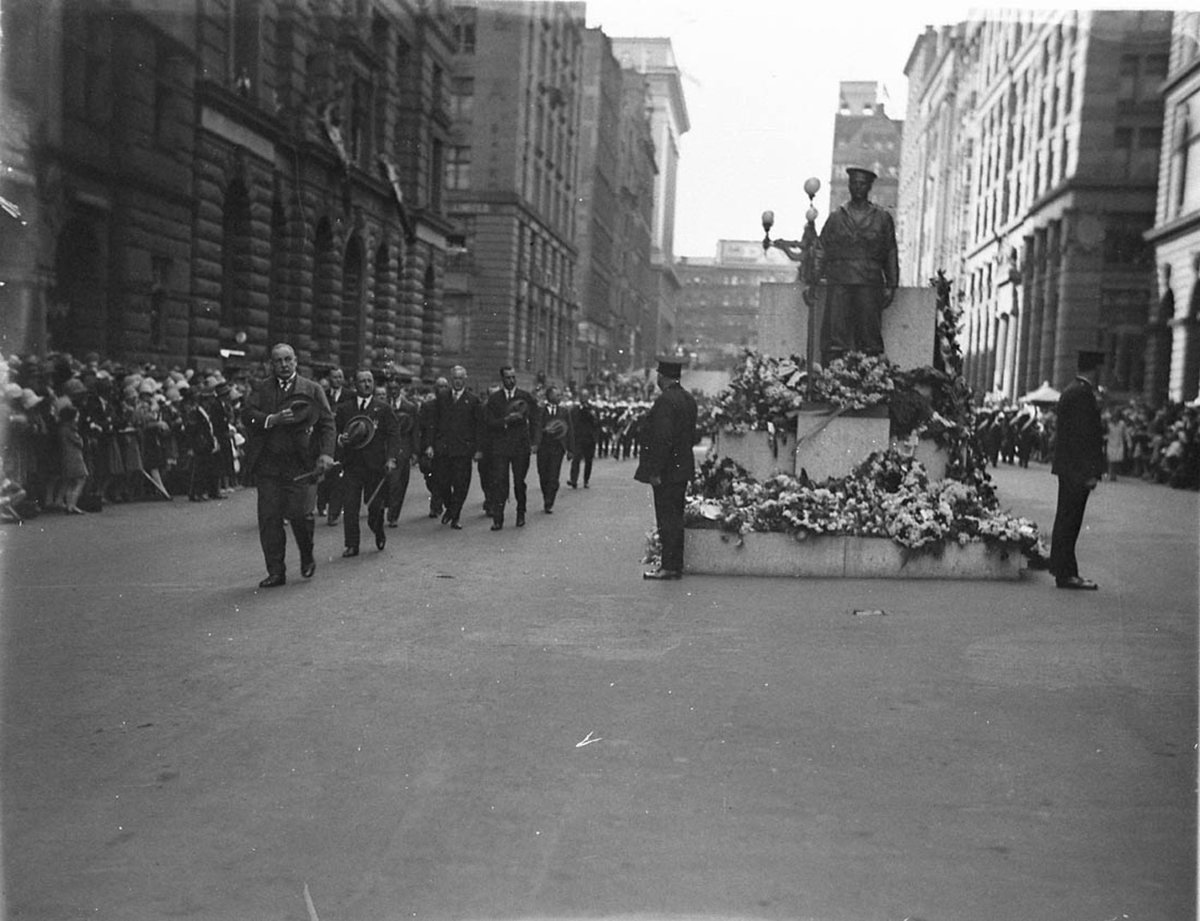 Veterans in civvies pass the Cenotaph, Sydney city centre (1930s)