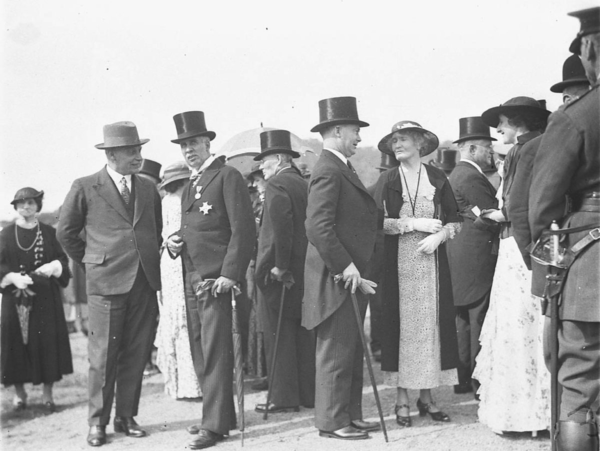 VIPs in top hats and frock coats waiting to meet the Duke (1925–57)