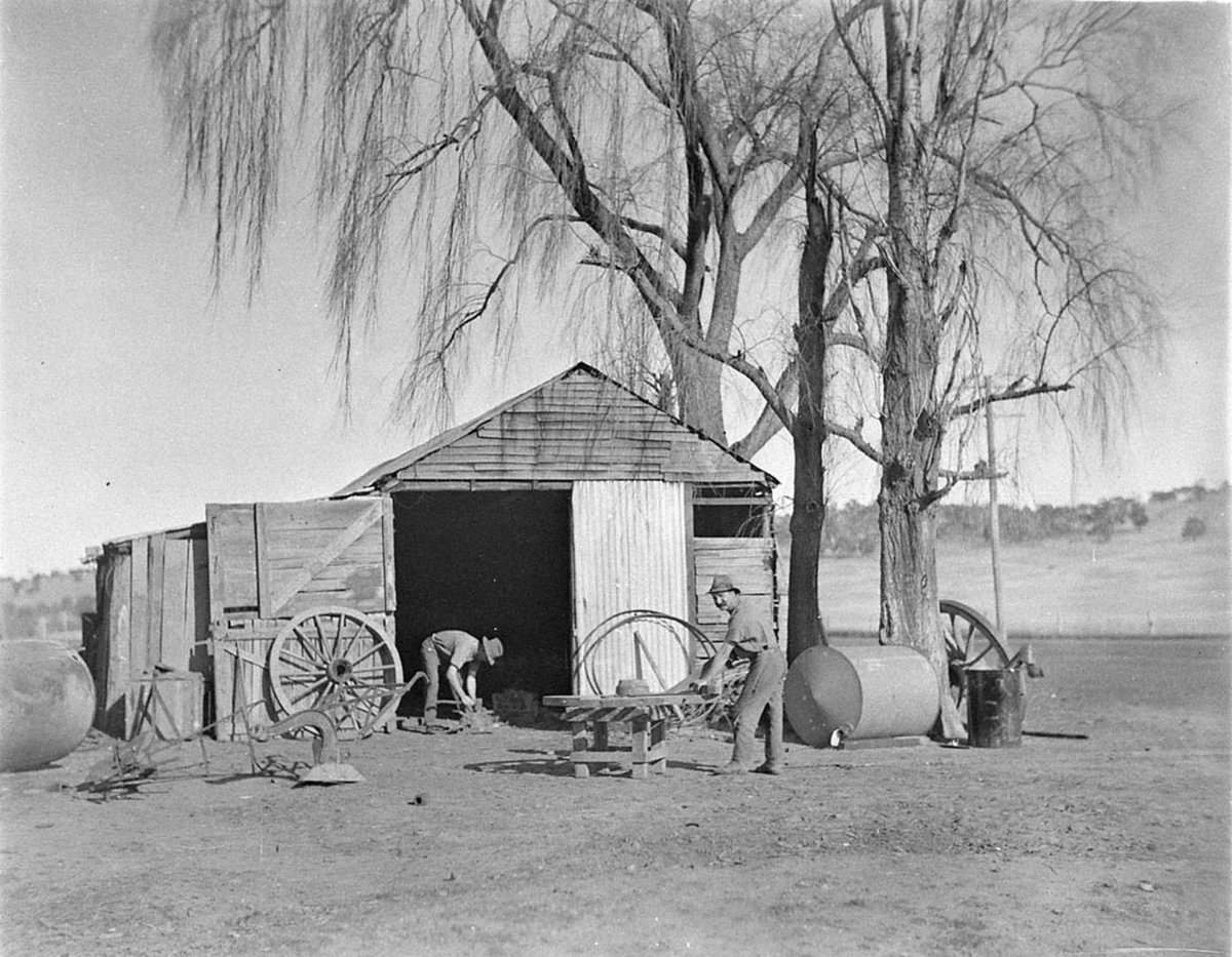 Wheelwrights working on a wagon wheel at Jindabyne (1930s)