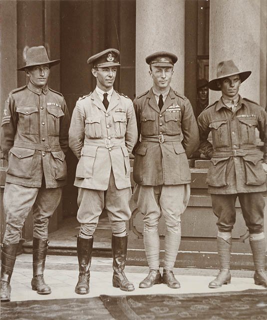 Sgt. Bennett, mechanic ; Keith Smith ; Ross Smith ; Sgt. Shiers, mechanic (left to right), on Sydney Town Hall steps after first UK-Australia flight, 14 Feb 1920, Sydney city centre (c. 1920)