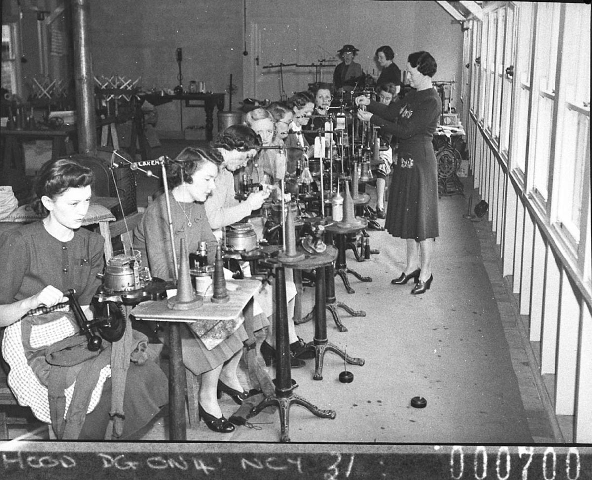 Women volunteers operating knitting machines (taken for Australian Comforts Fund), by Sam Hood March 1944, Neutral Bay