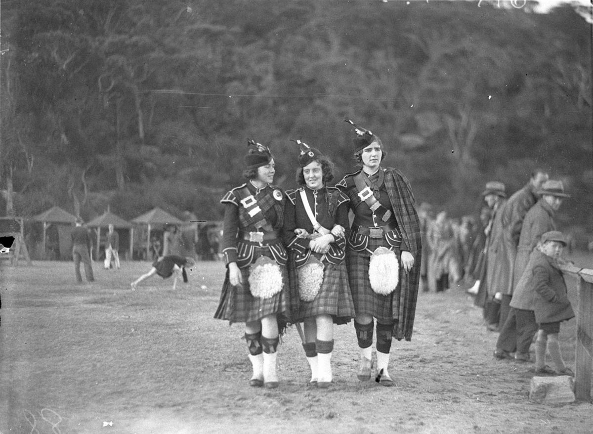 Three Bonnie Highland lassies (Hazel Hunt, Hazel Hughes and Jean Gillies) in full regalia at Six Hour Day sports, 1st October 1934, by Sam Hood, Sydney