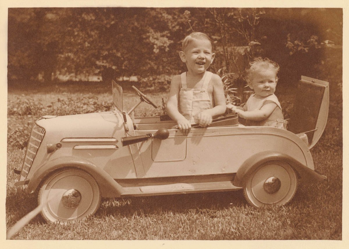 Boy in pedal car with baby in 'rumble seat', Sydney, ca. 1935 - photographer Sam Hood (c. 1935)