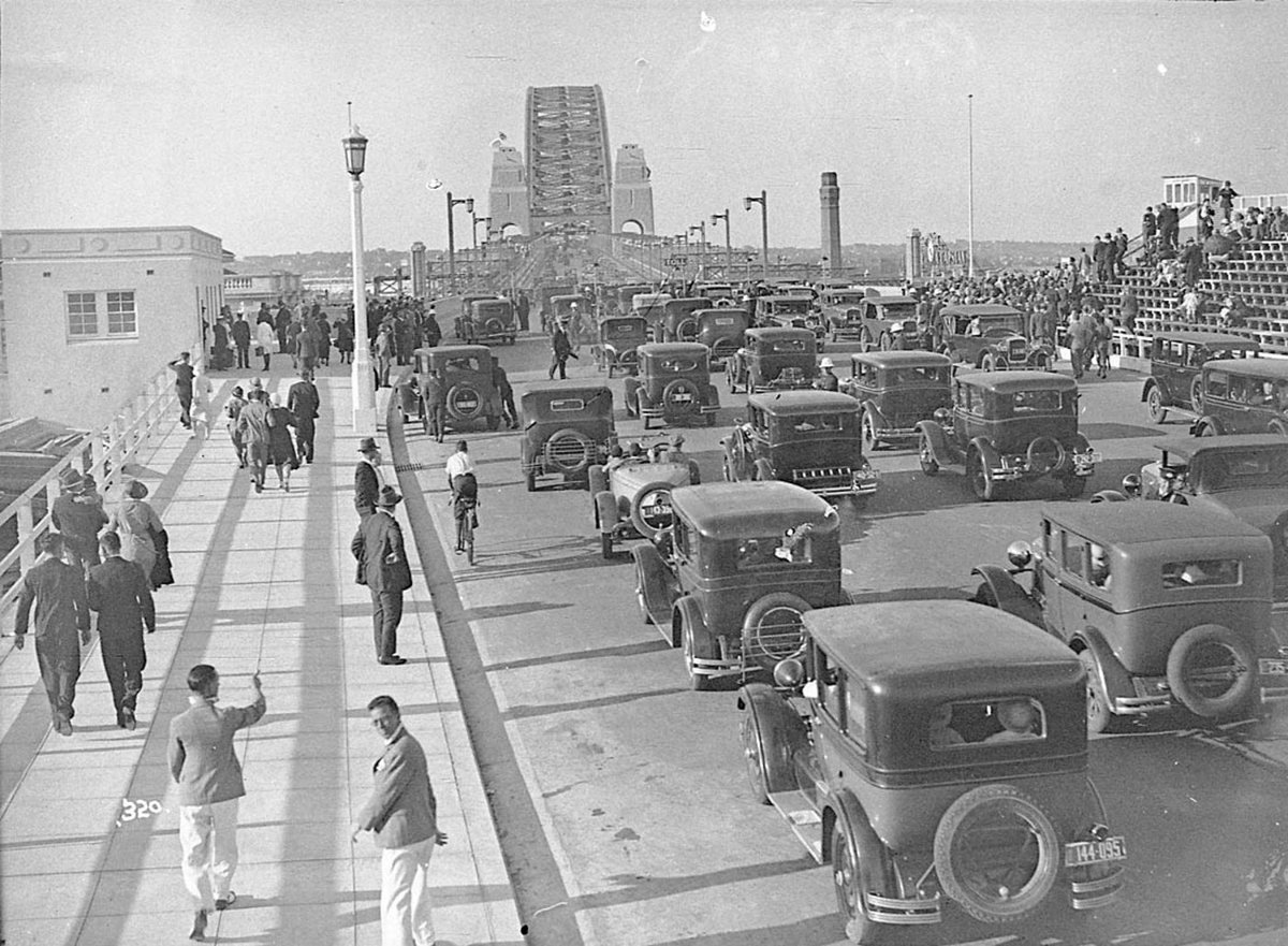 Motor cars driving across the Bridge, Sydney Harbour Bridge Celebrations, 19 March 1932, Hall and Co, Milsons Point