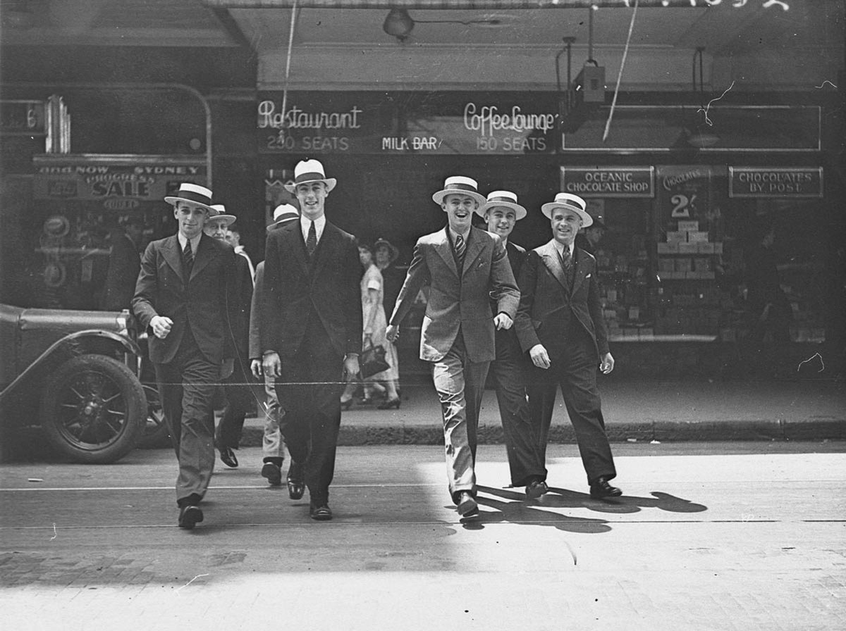 Seven men modelling hats in Pitt Street, for City Hatters, 1 November 1934, by Ernie Bowen, Sydney city centre
