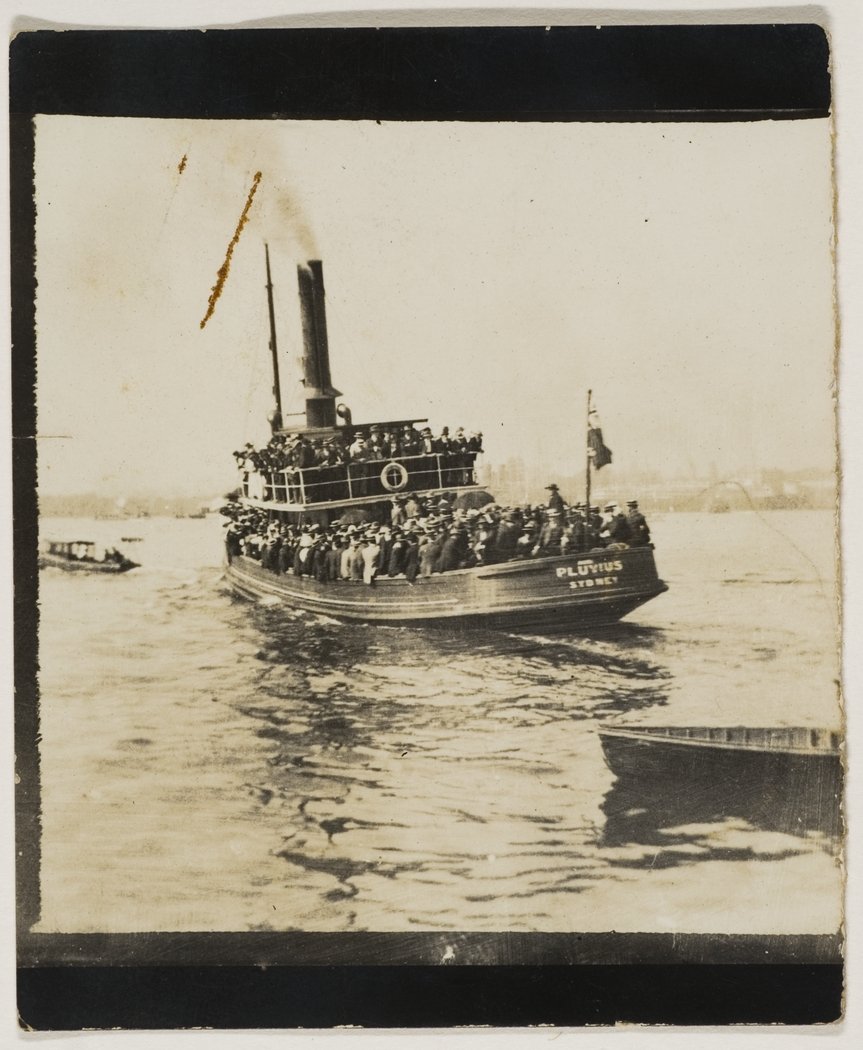 Steam tug Pluvius taking passengers who usually travelled by ferry - ferry strike, 1910 on Sydney Harbour from Royal Australian Historical Society - Sydney photographs, ca. 1879-1956
