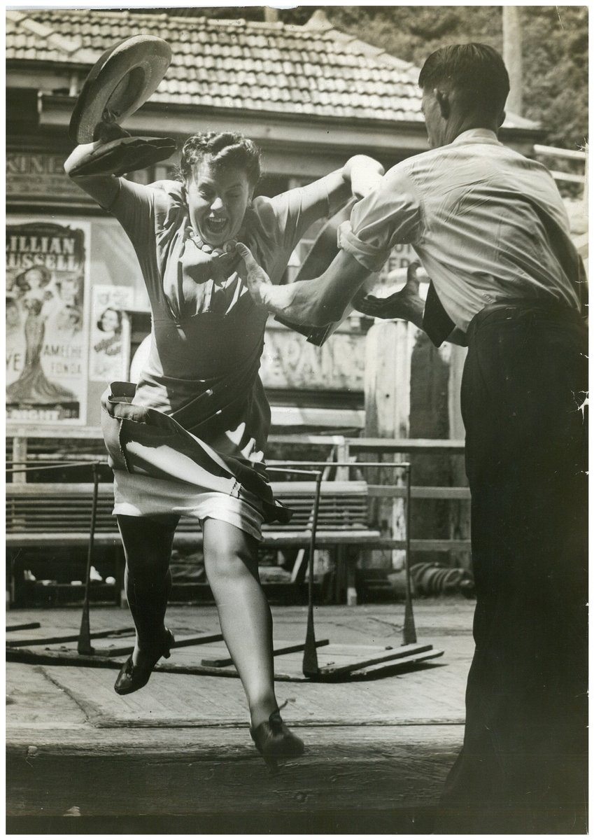 Woman leaping for the ferry caught by deckhand, Sydney Harbour, 1940 - possibly Pix