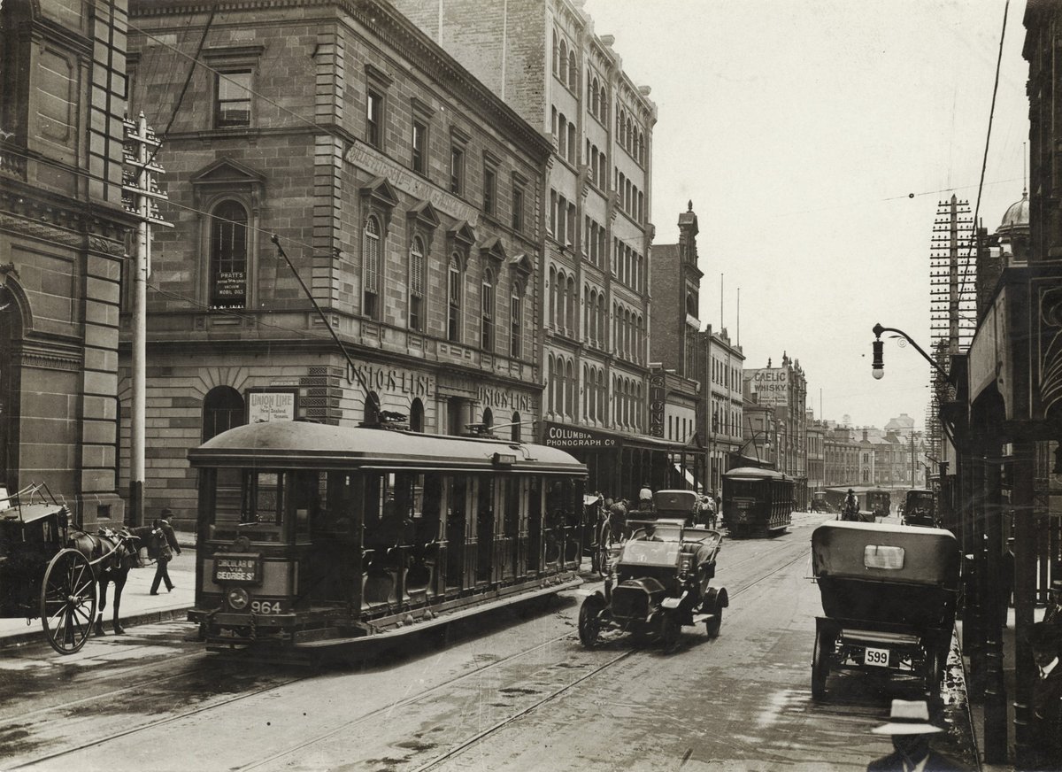 (Looking north along George Street (with tram, T-model Ford and hansom cab) from Union Line Building (incorporating the Bjelke-Petersen School of Physical culture), corner Jamieson Street), n.d. by, c. 1935