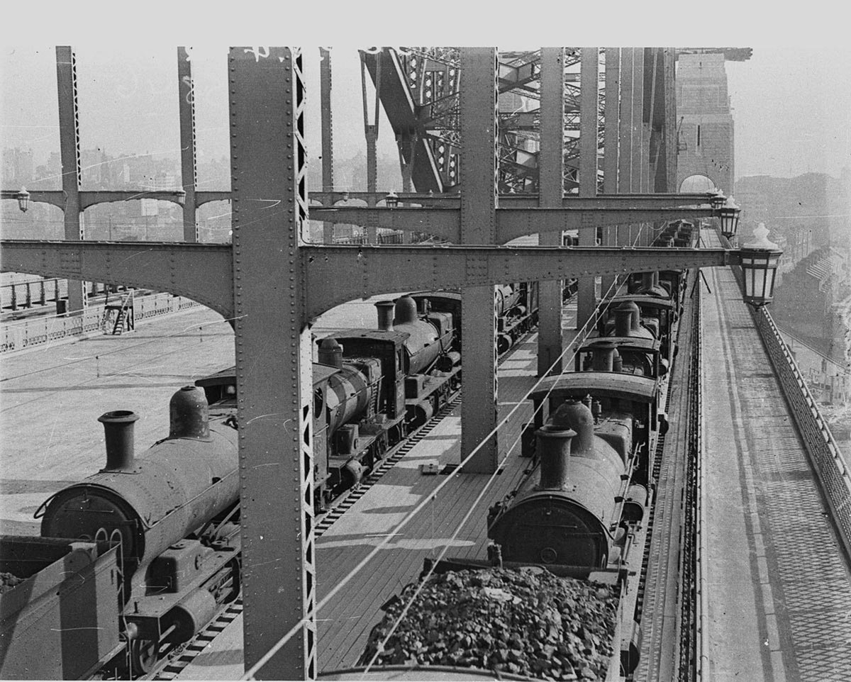 Load-testing of Harbour Bridge when fifty steam locos were run on western side, February 1932, by Ted Hood, Sydney Harbour