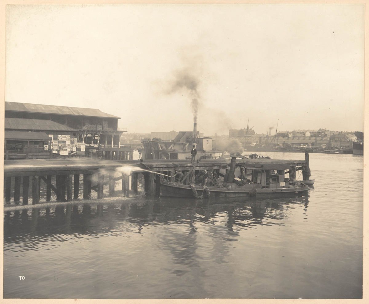Cleaning the Wharves from Views taken during Cleansing Operations, Quarantine Area, Sydney, 1900, Vol. II - under the supervision of Mr George McCredie, F.I.A., N.S.W. photographed by John Degotardi, Martin Place