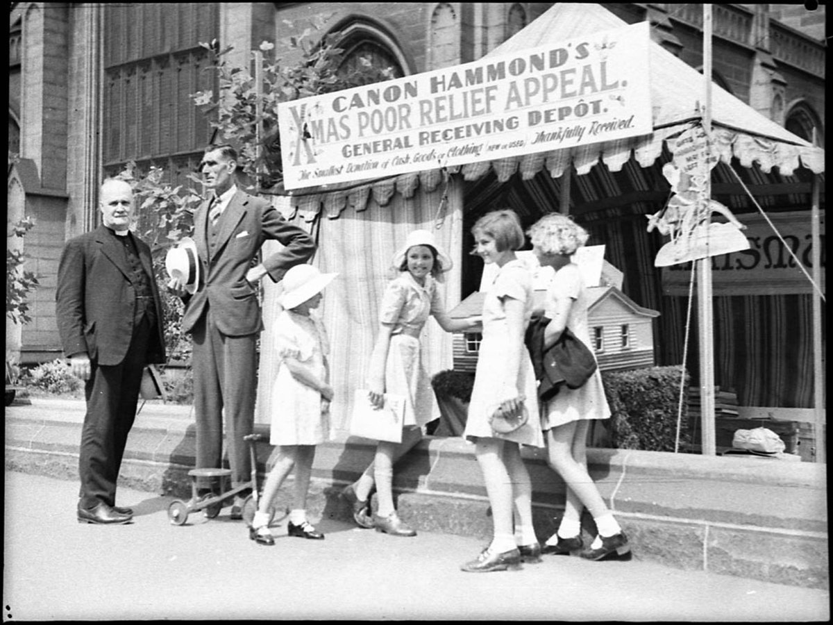 Canon Hammond Christmas poor relief appeal tent. December 1938, by Sam Hood