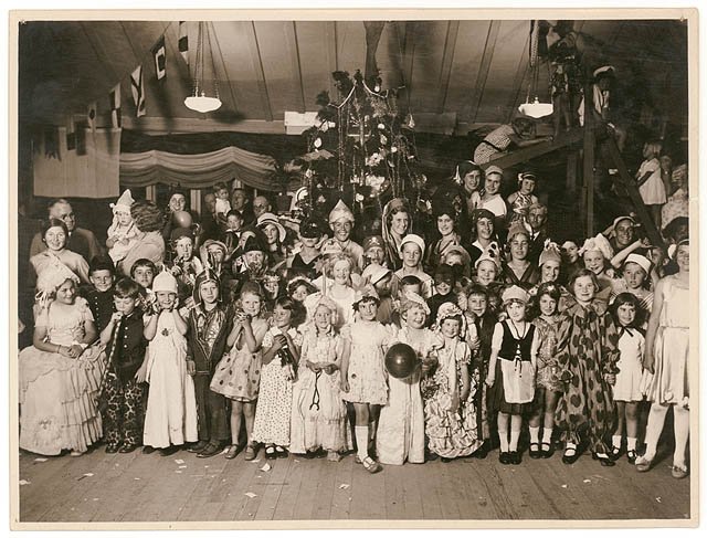 Fancy dress Christmas party, n.d. - by Sam Hood (1925–55)
