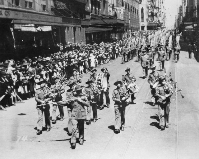 Members of the 2-19 Battalion marching down Castlereagh Street near the corner of Hunter Street in Sydney CBD during September 1940, Sydney city centre