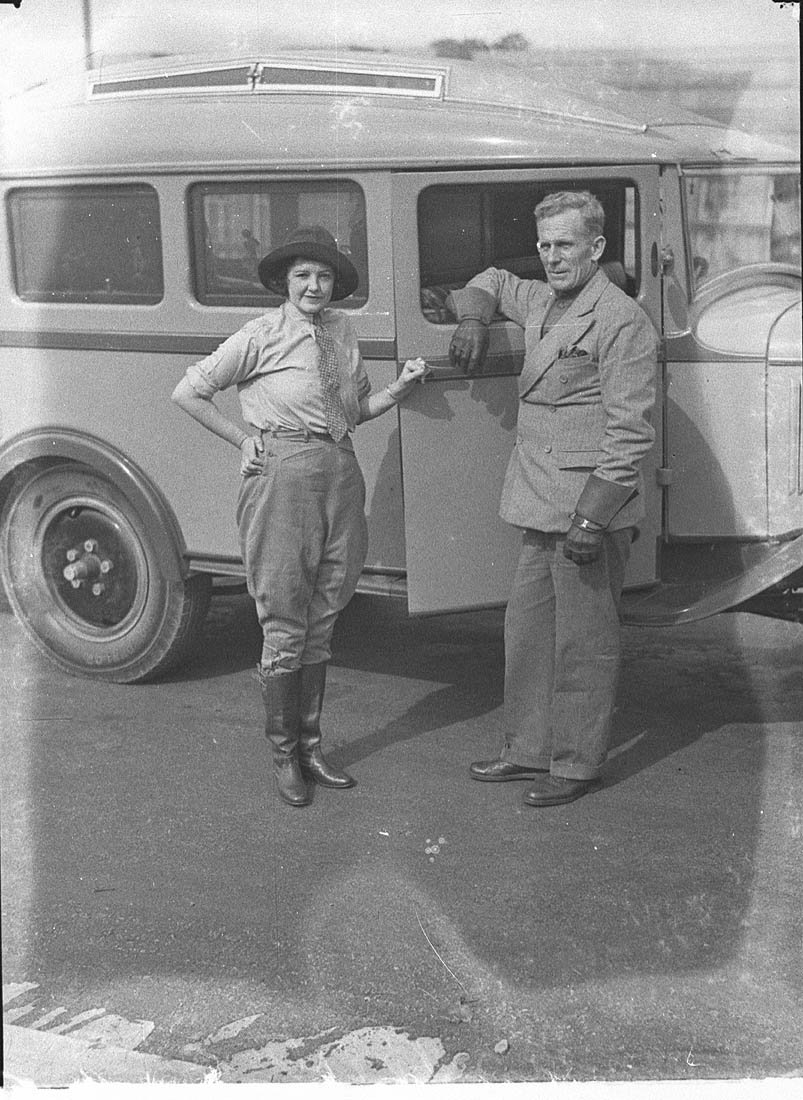 Francis Birtles, his wife of less than two months, Nea, and his touring car in front of the Public Library of New South Wales, Sydney, 9 May 1935 - photographer Sam Hood