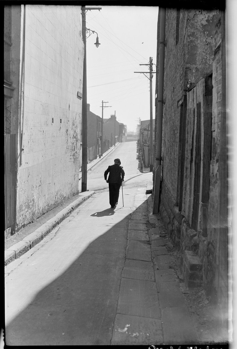 Old age pensioner in Surry Hills alley with stick, Aug 1949, from Series 02- Sydney people & streets, 1948-1950, photographed by Brian Bird