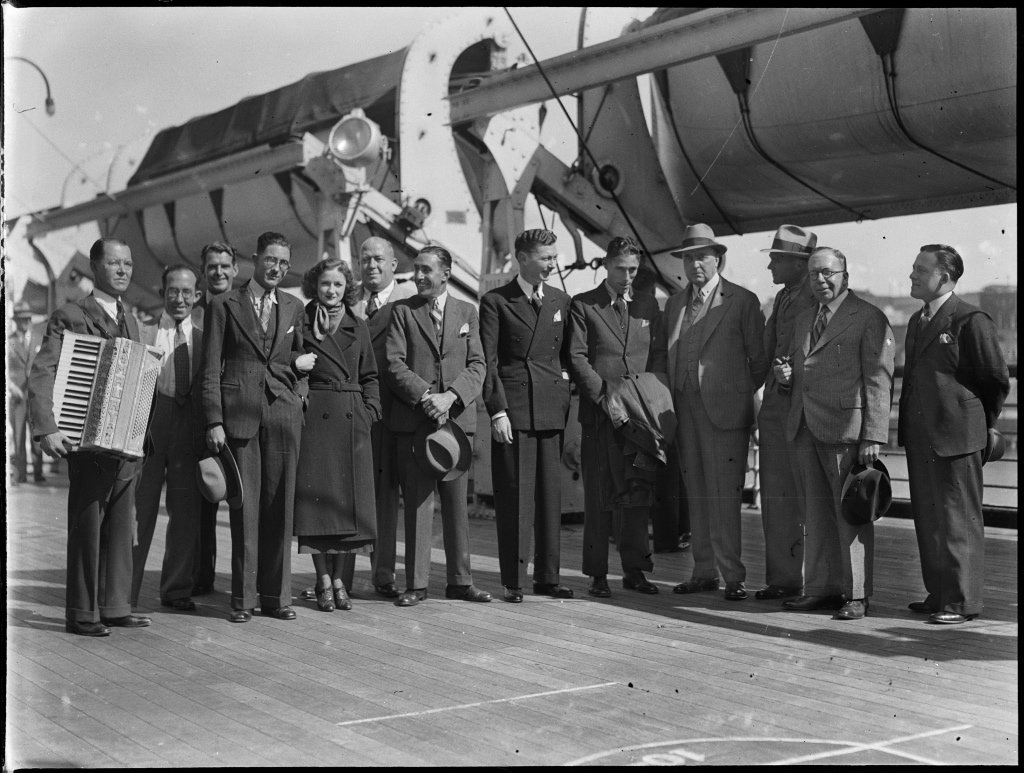 Group including dance band members on board the SS Mariposa in Sydney Harbour (1930)