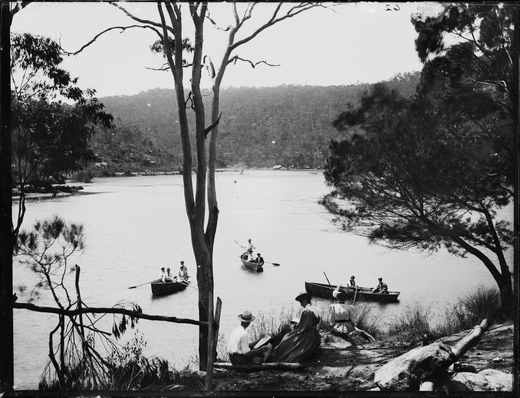 Three rowing boats on river possibly Lane Cove, with a man and woman on bank (1900)