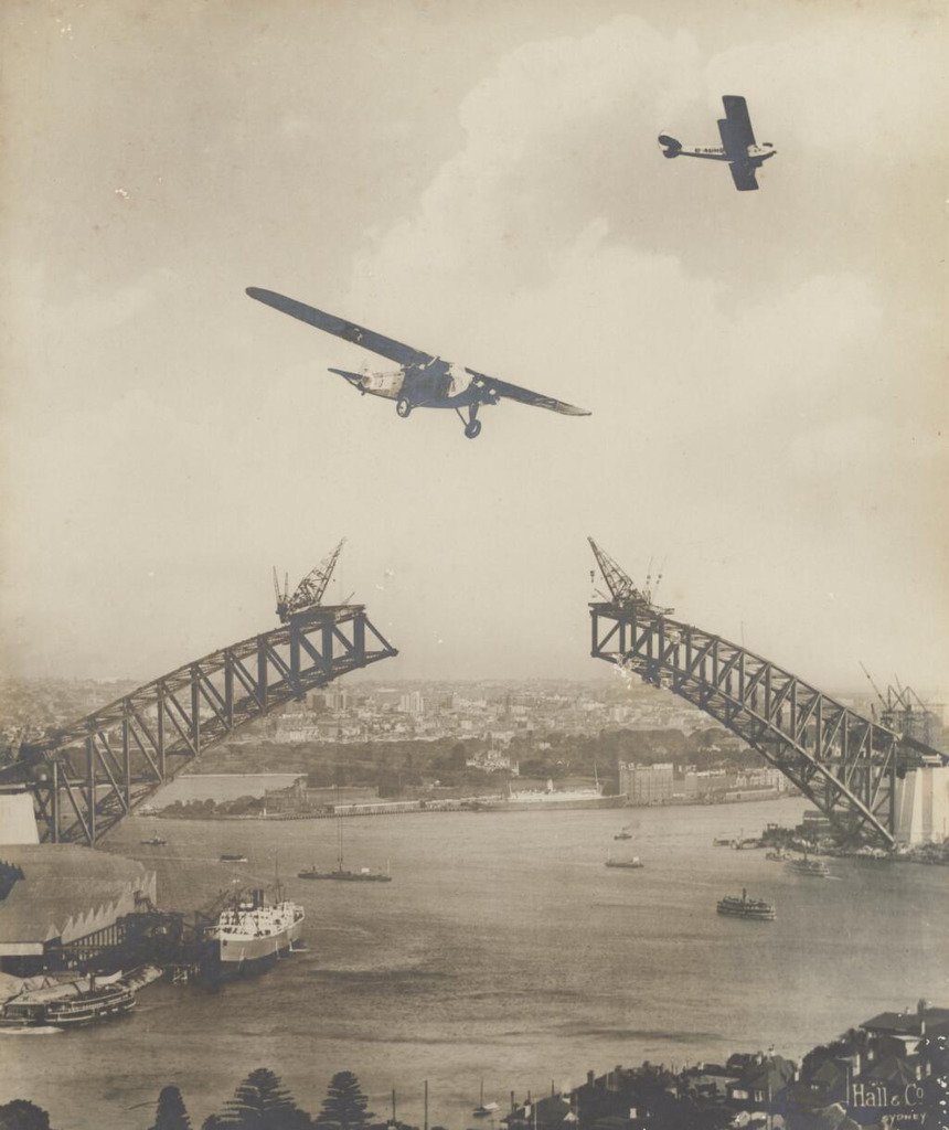 Southern Sun flying over Sydney Harbour Bridge, 1931 - E. W. Searle (1930)
