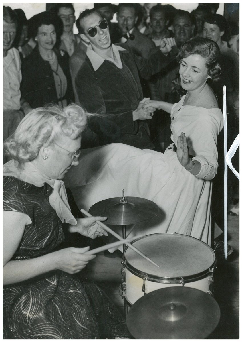 June Howarth of Canterbury and Ray Shart of Bankstown dance to the band with drummer Peg Clark of Blackheath, on the ocean cruise to Broken Bay, South Steyne, December 1953 - Australian Women's Weekly