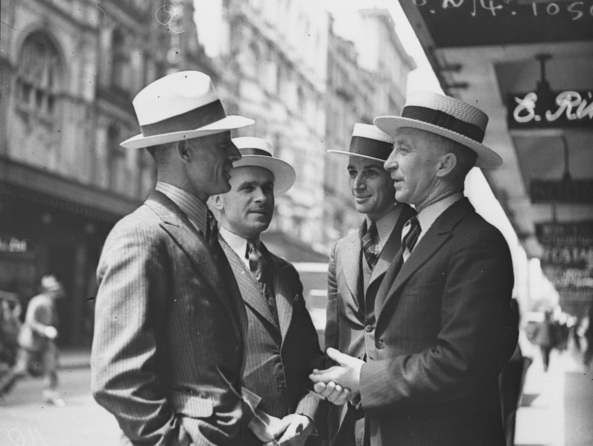 Four men modelling hats in Pitt Street, Sydney city centre (1934)