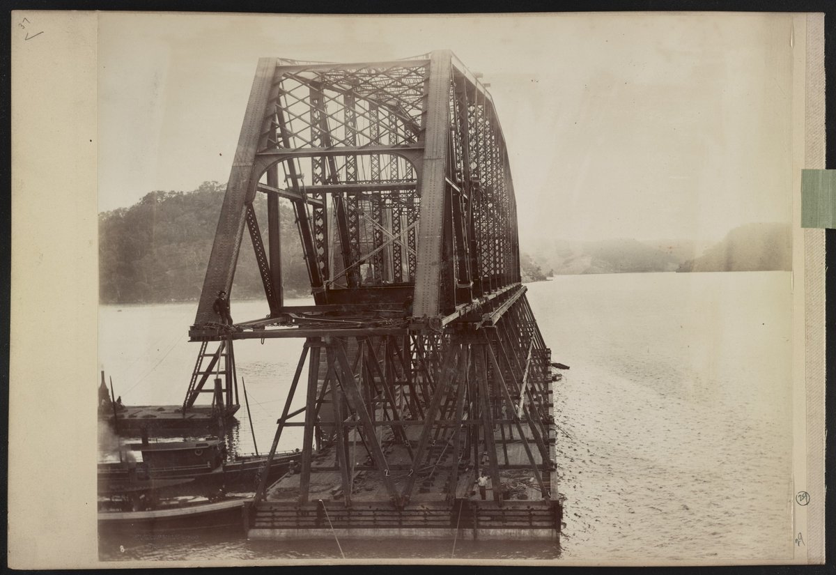 Span number 5 of Hawkesbury River Railway Bridge, New South Wales, Australia, atop timber framework on pontoon, being pushed by small boats) - C. Bayliss photo, Sydney LCCN2016651666 (1888)