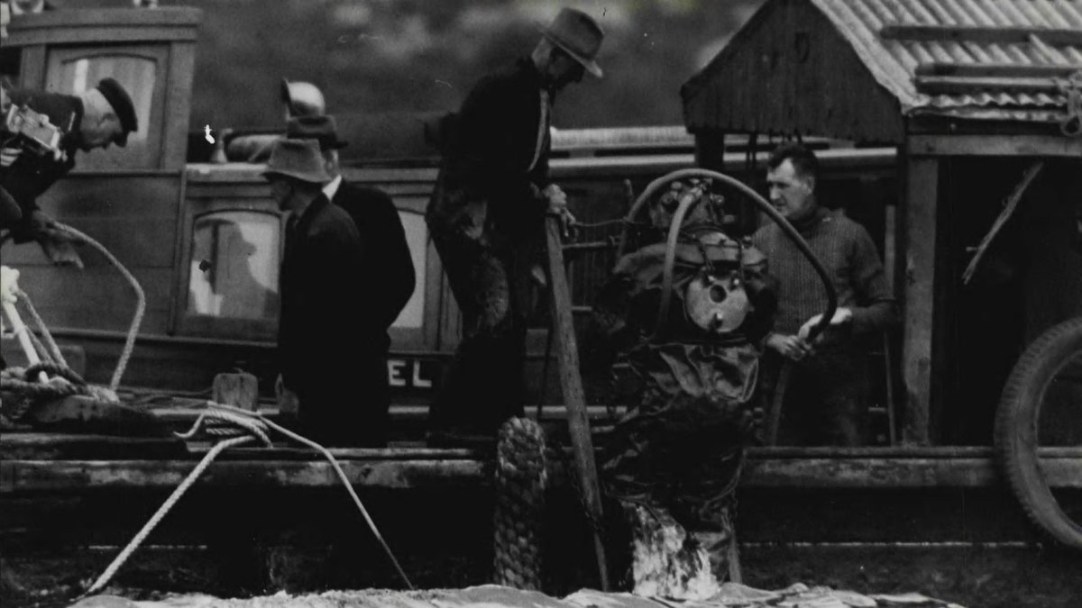 Diver ascends with news of four bodies in sunken ferry Rodney cabin Sydney Harbour February 14, 1938