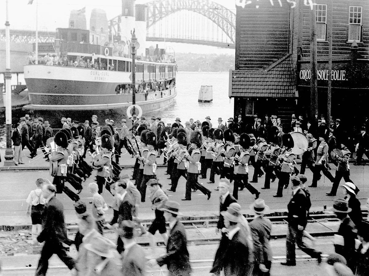 Sydney Ferry CURL CURL and Visiting Grenadier Guards Band march past Circular Quay ferry wharves 1930s