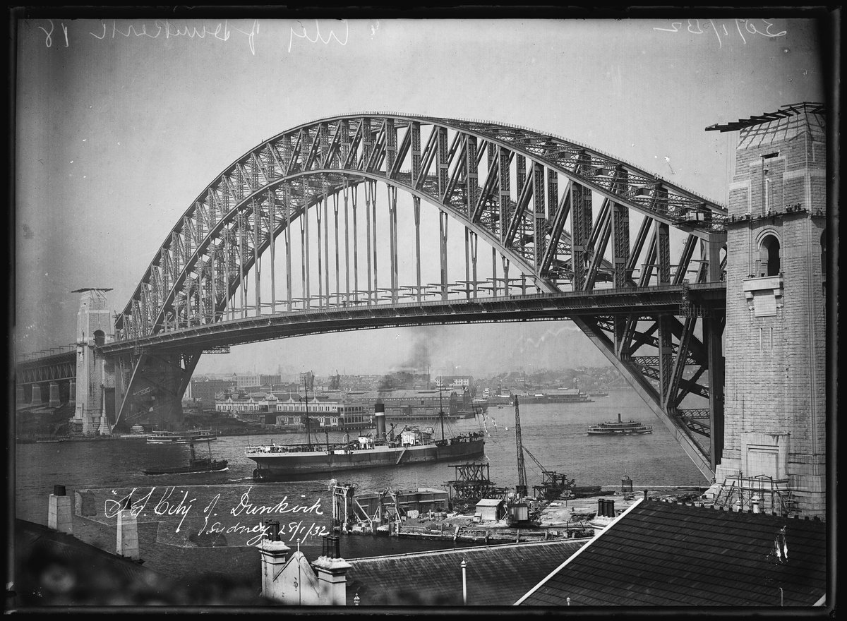 Glass plate negative of Ellerman’s City Line’s, SS ‘City of Dunkirk’, freighter passing under Sydney Harbour Bridge 28 January 1932 (1928)