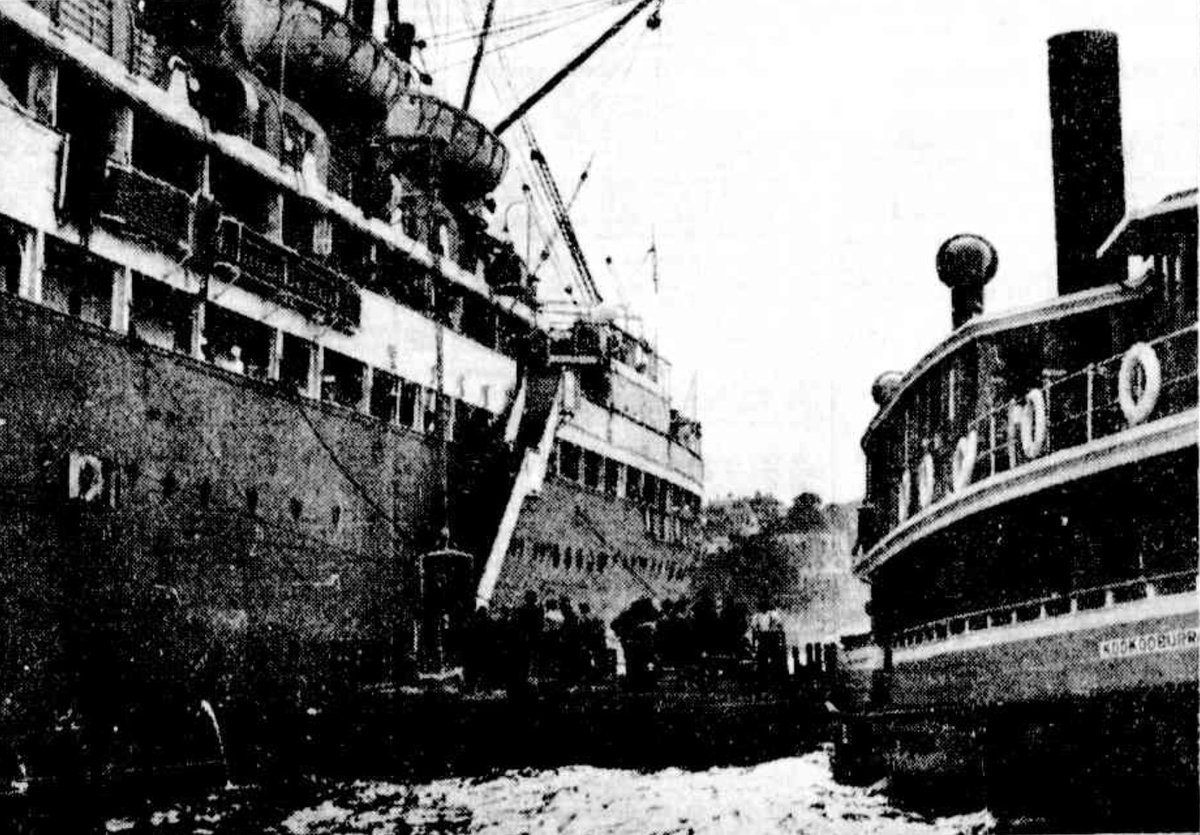 Sydney ferry KOOKOOBURRA transferring passengers to motorship MANUNDA at Neutral Bay 24 Oct 1931