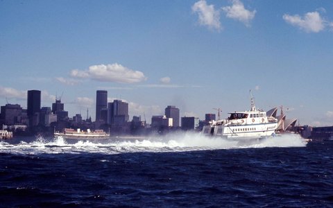 Sydney ferry BELLUBERA and Hydrofoil FARILIGHT passing on Sydney Harbour at Fort Denison, 1970