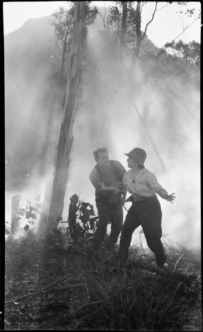 Film party in the bush, in a bushfire, ca. 1925 (original envelope marked "Mr Marks", portraits incl. and a C & W cinema camera.) (Possibly the film "Joe", 1924), by Sam Hood - 5938379135, 1924–25
