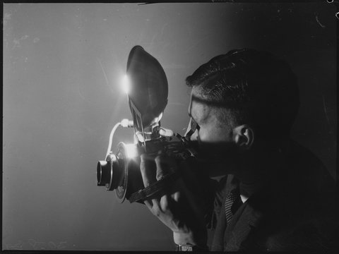 Photographer with camera, Sydney, 1939