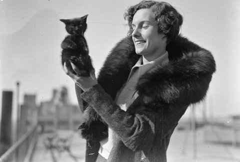 Jean Batten with cat mascot Buddy (cropped), 1934